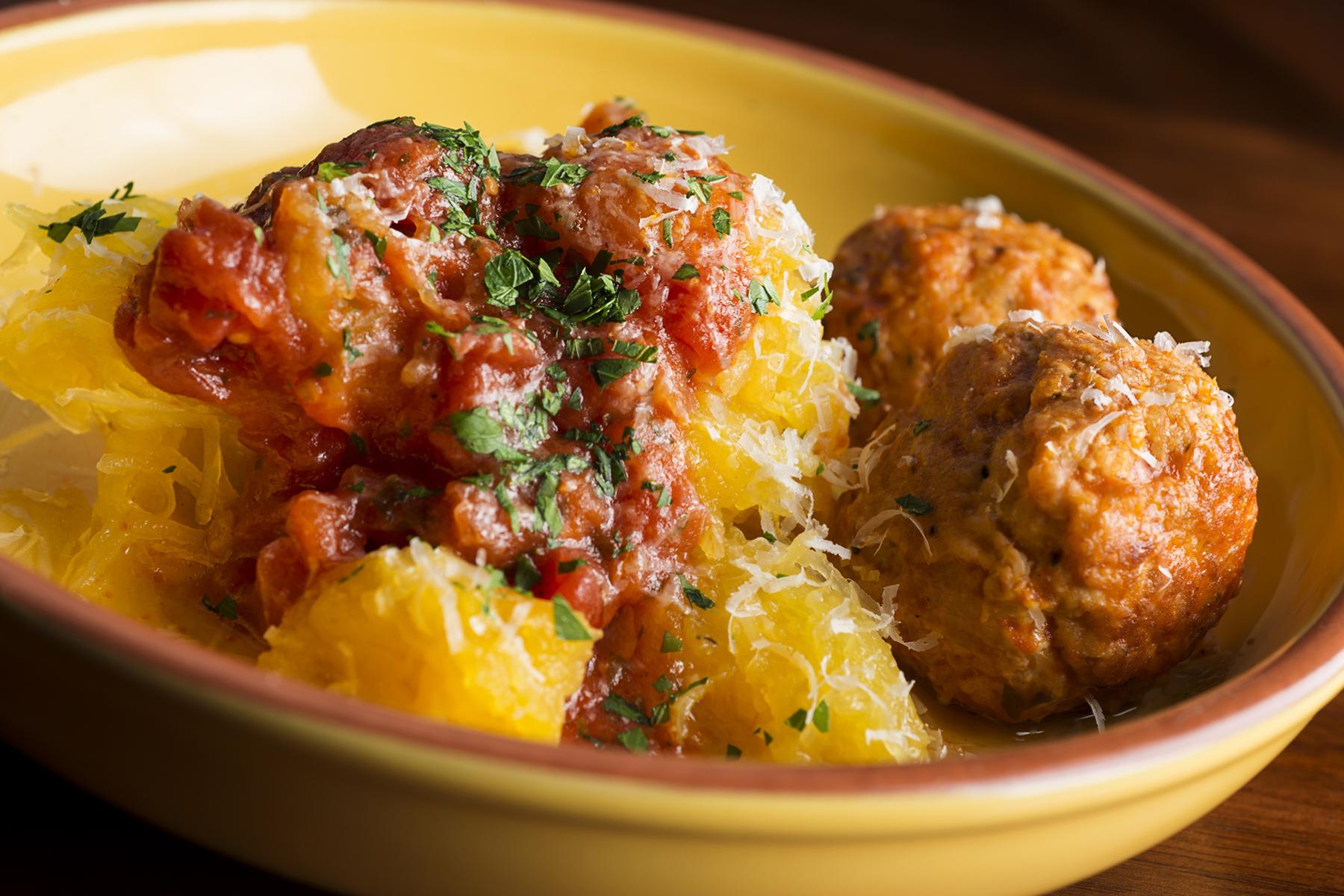 A bowl of Herbed Meatballs with Roasted Tomatoes & Spaghetti Squash