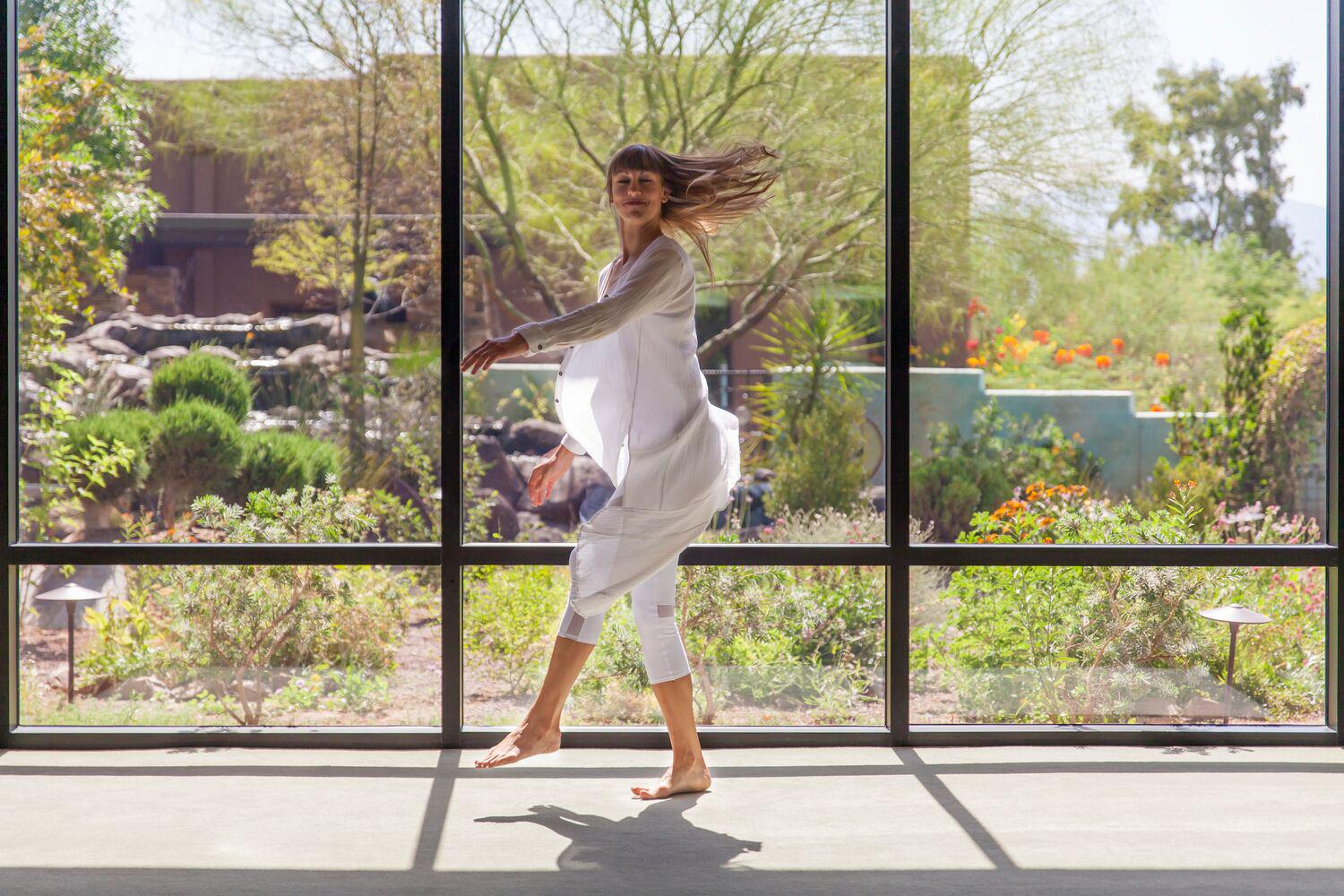 a woman walking through the labyrinth at Canyon Ranch Tucson Wellness + Spa Resort
