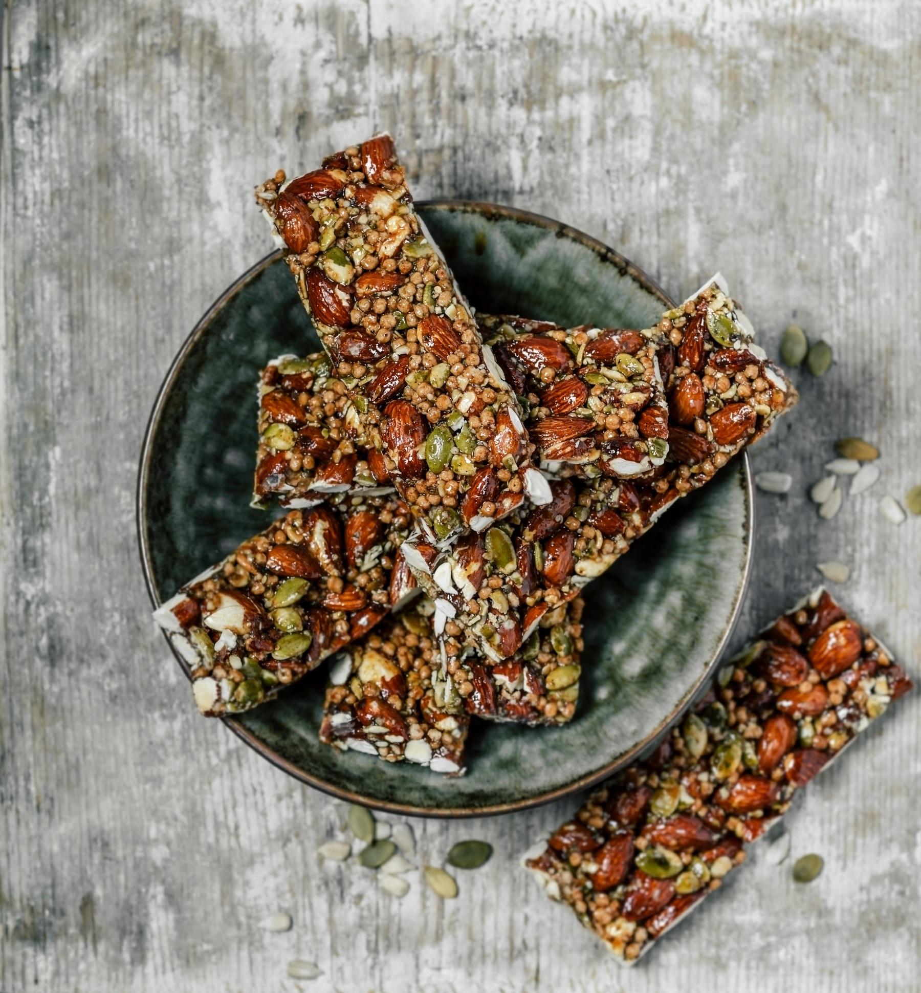 Overhead view of a bowl filled with granola bars.