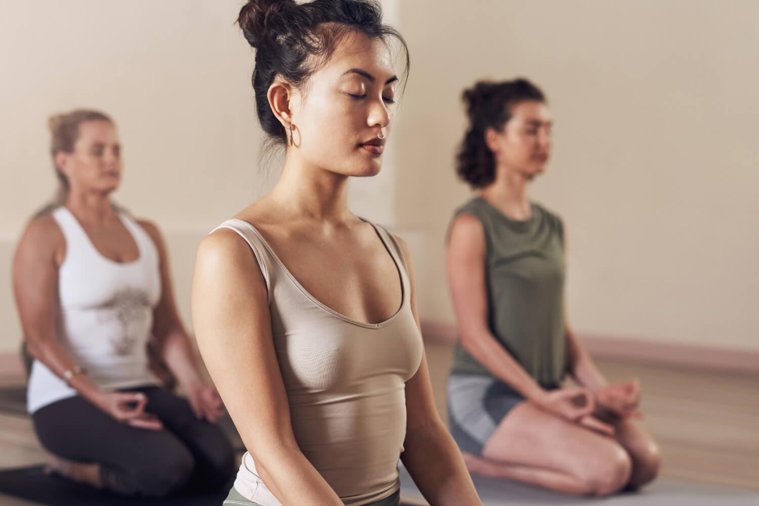 a group of women meditating