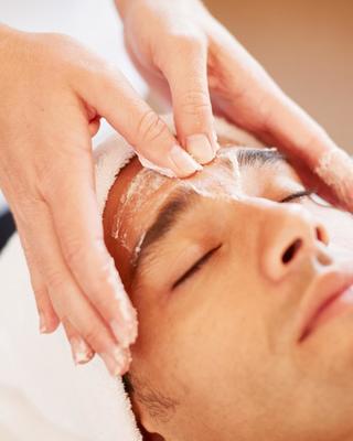 A man getting a facial scrub at Canyon Ranch Fort Worth Spa