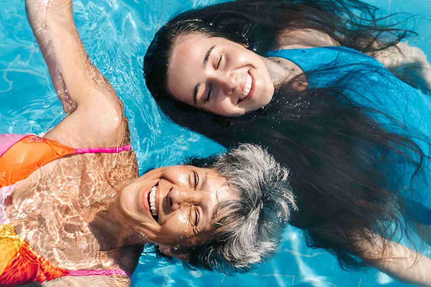 A woman and her daughter in the pool
