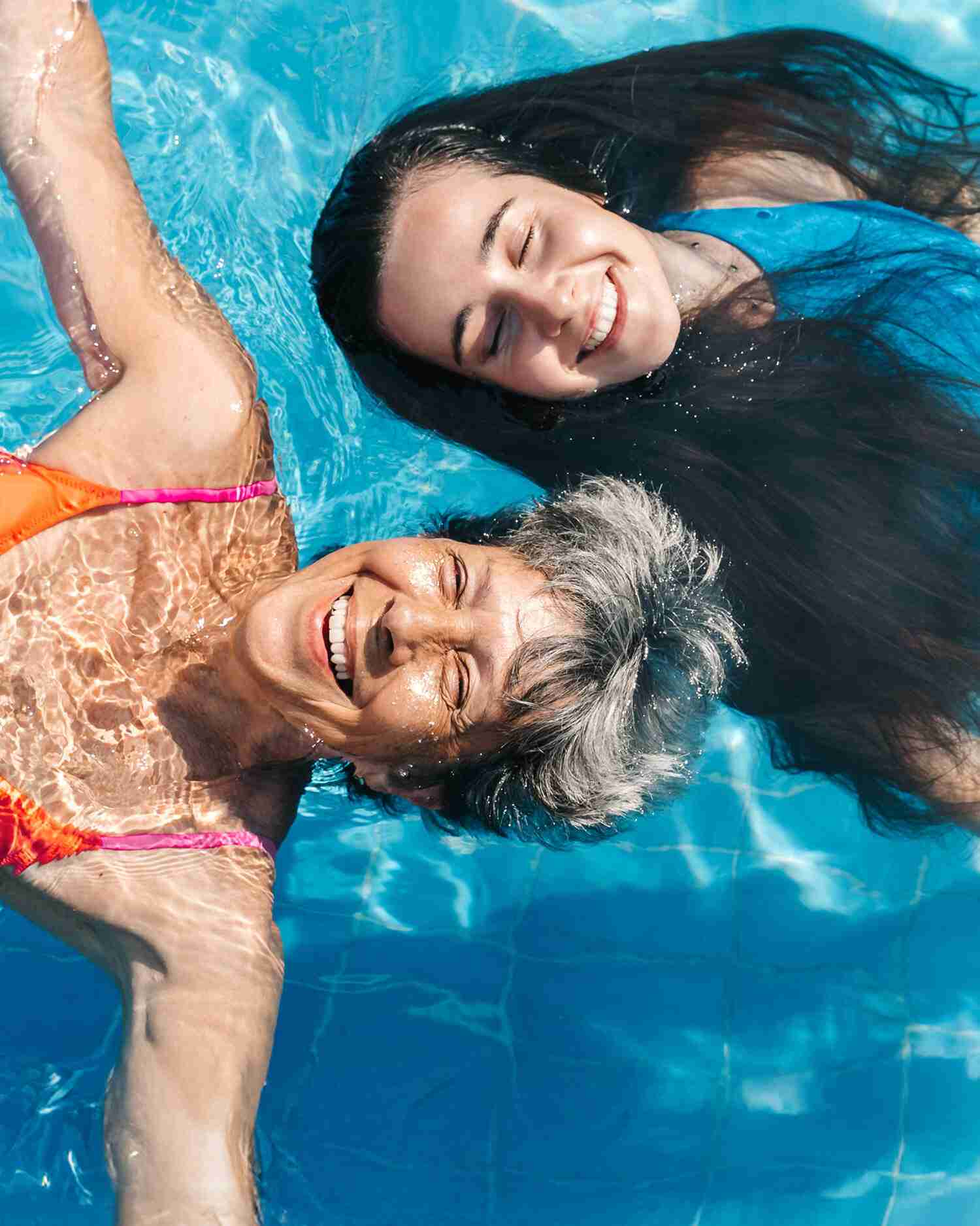 A woman and her daughter in the pool