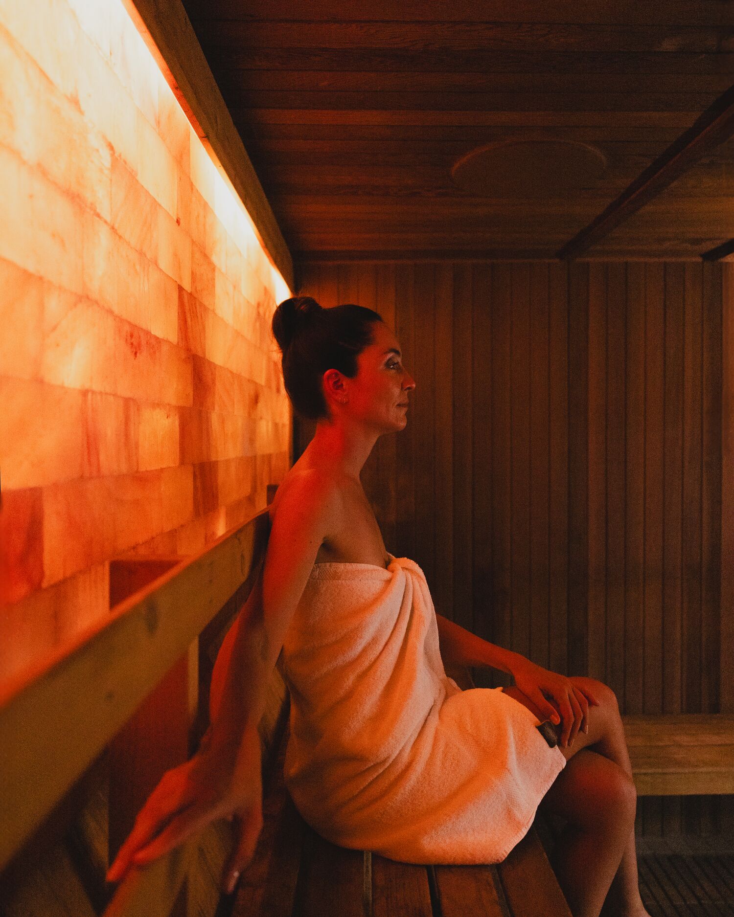 A woman in a salt wall sauna