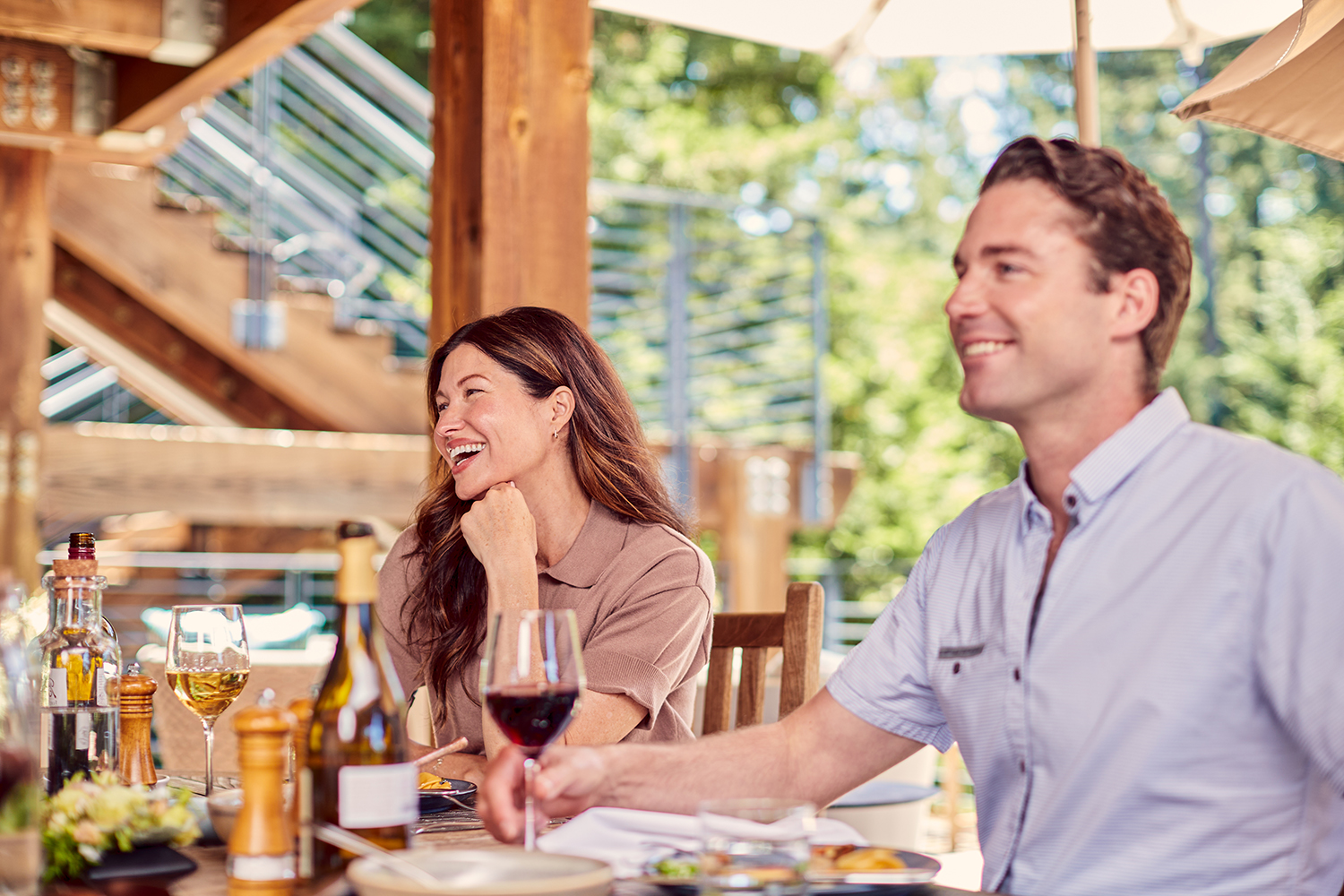 Family eating out on the patio at Canyon Ranch Lenox Spa Resort