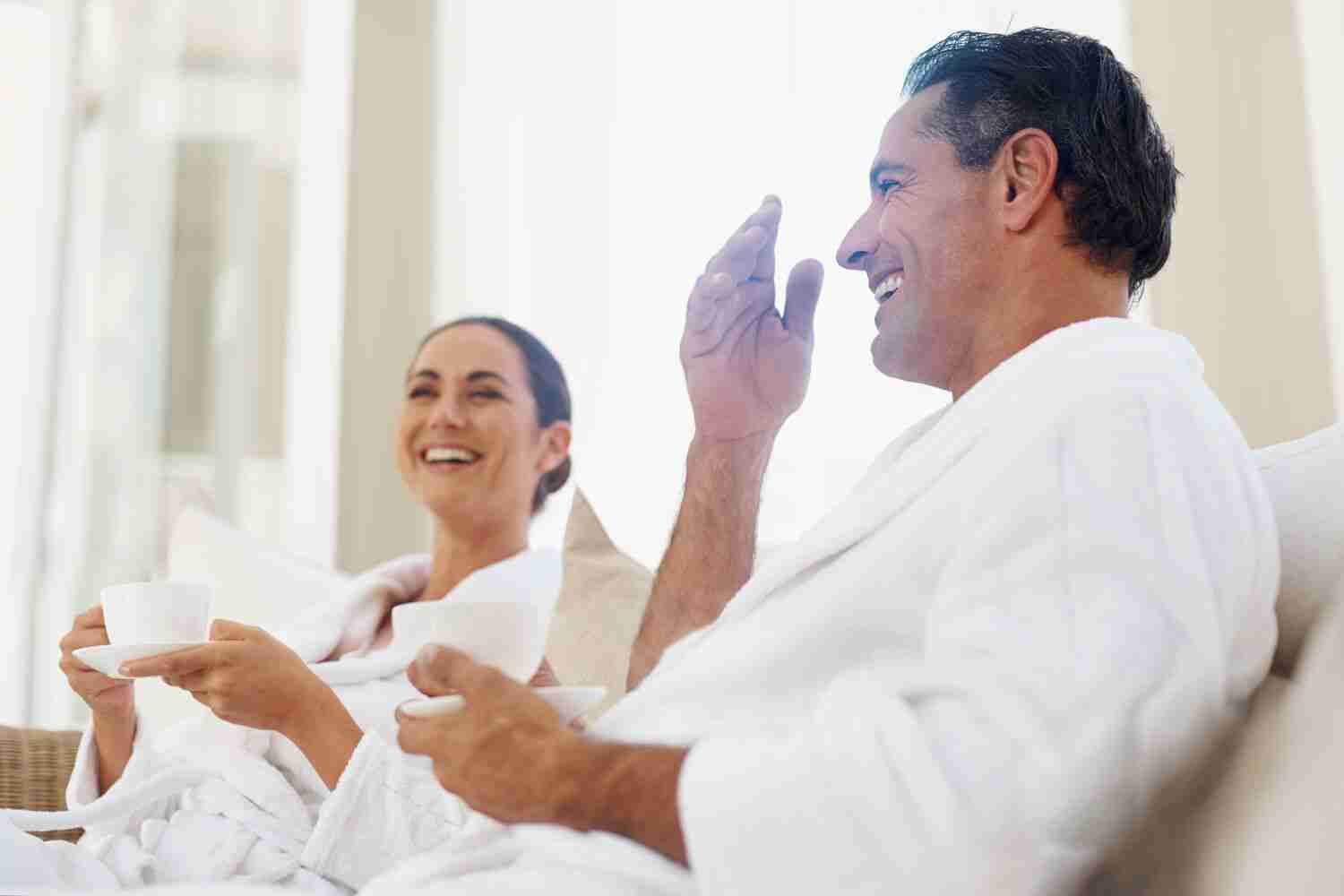 couple wearing robes and relaxing in spa