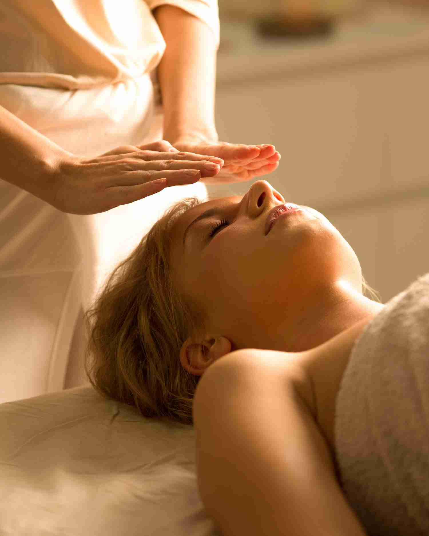 A woman getting a reiki healing