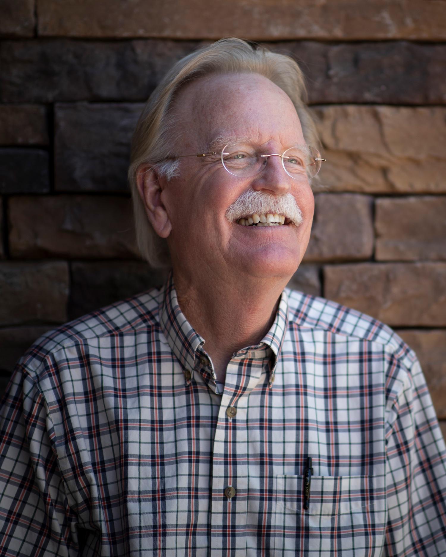 Headshot of John Shukwit