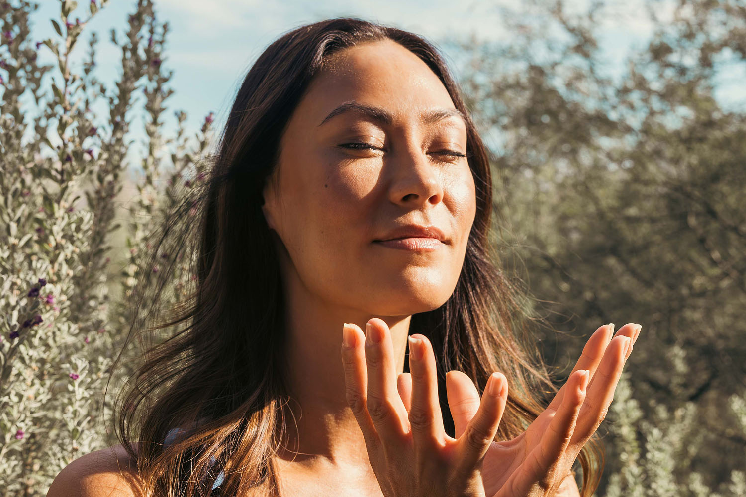 A woman meditating in the desert