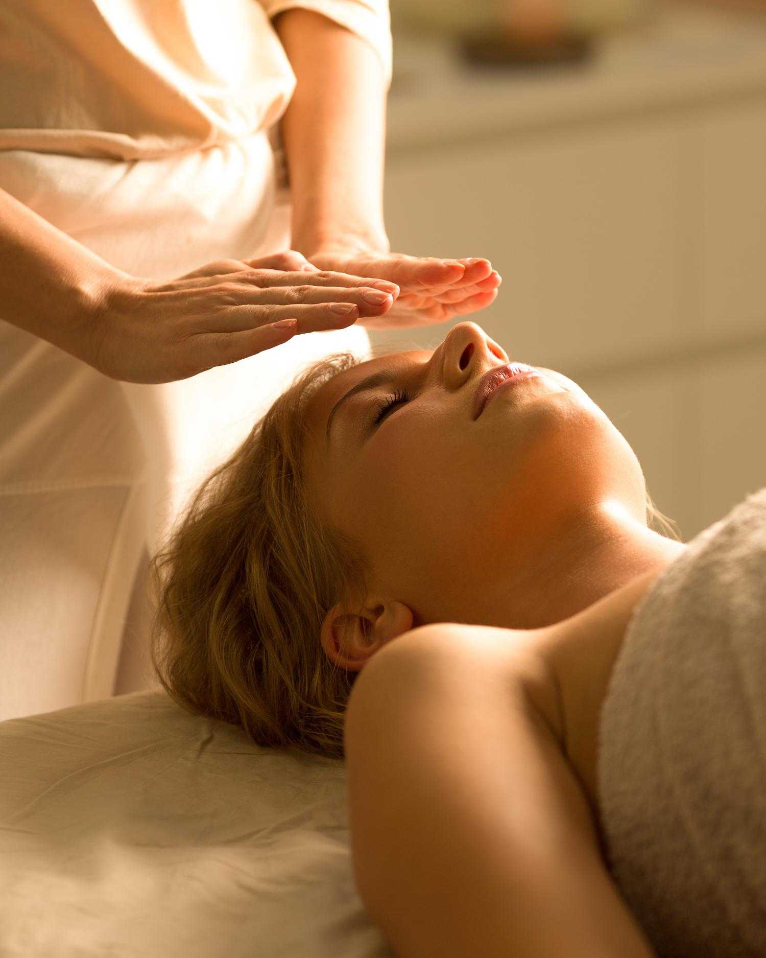 A woman getting a reiki healing