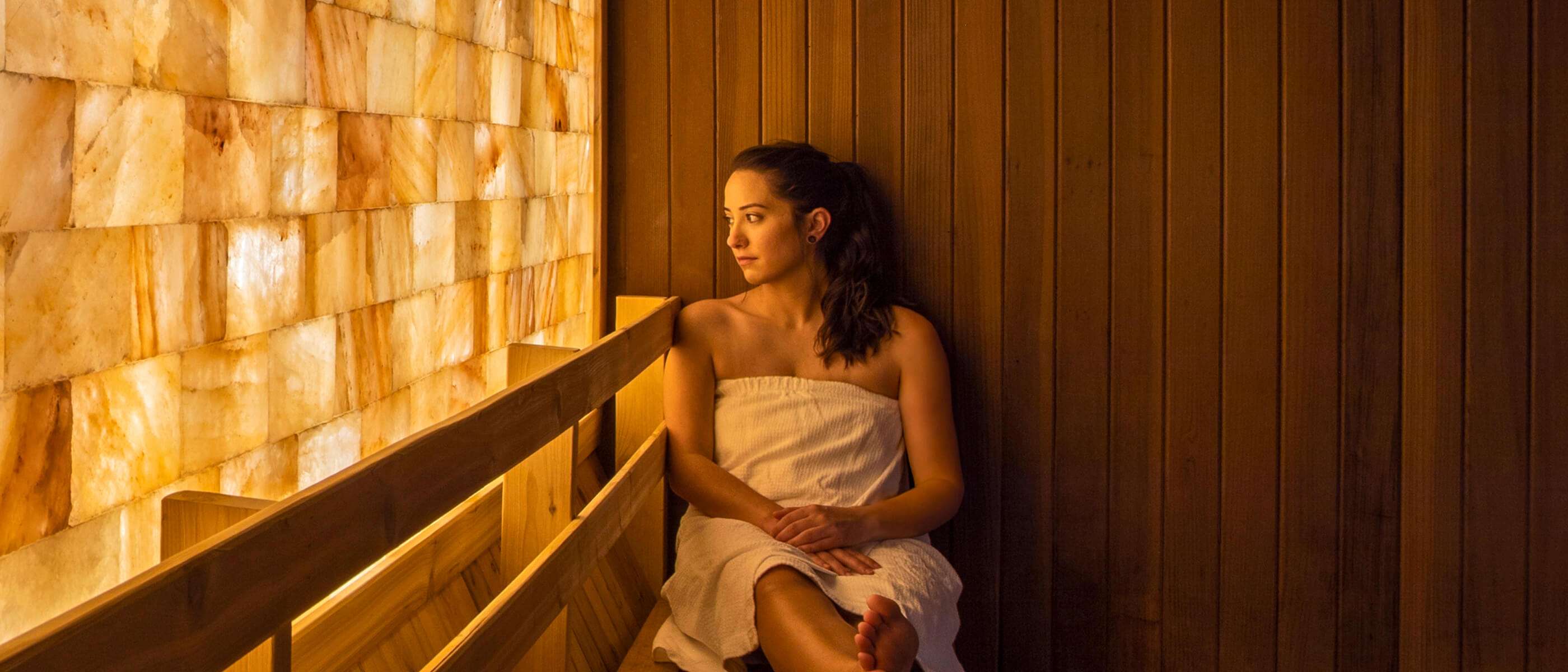 A woman sitting in a salt sauna