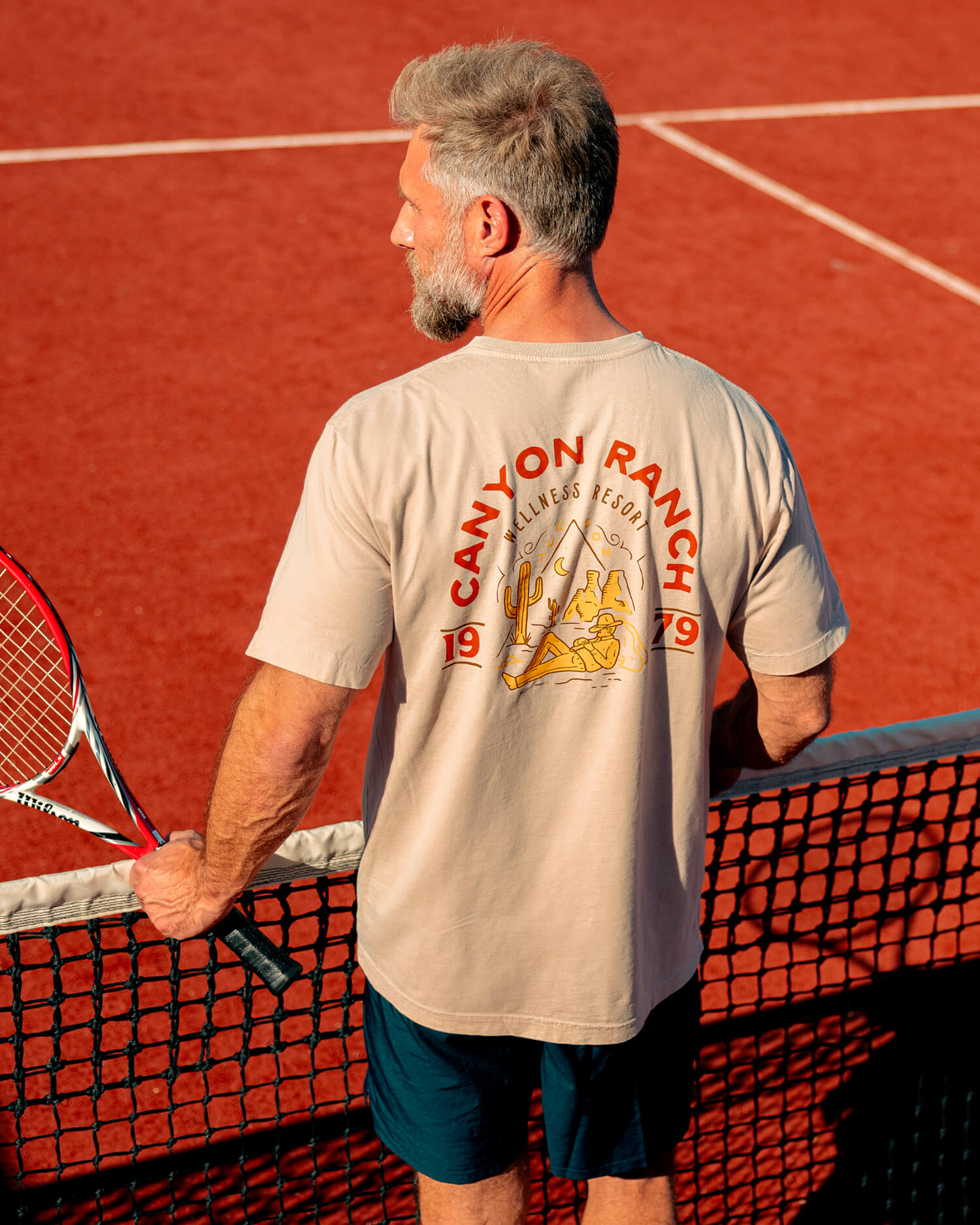 A man in a canyon ranch tshirt