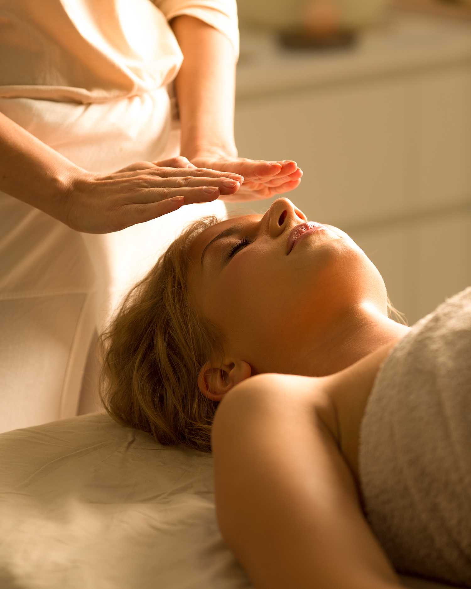 A woman getting a reiki healing