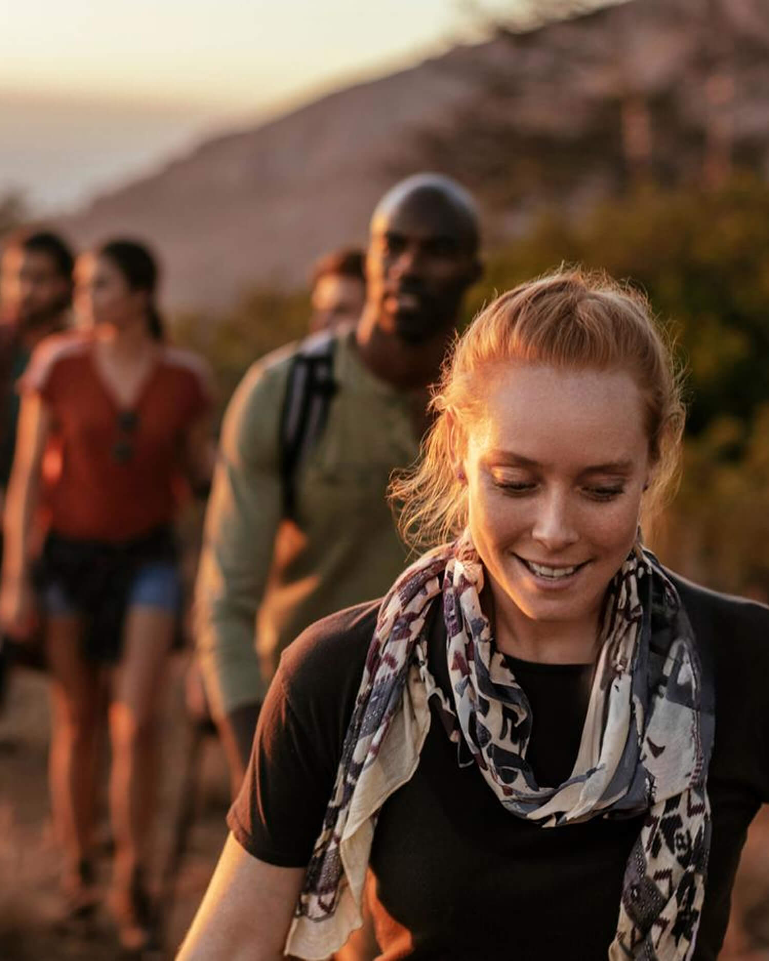 a group hiking on a hillside